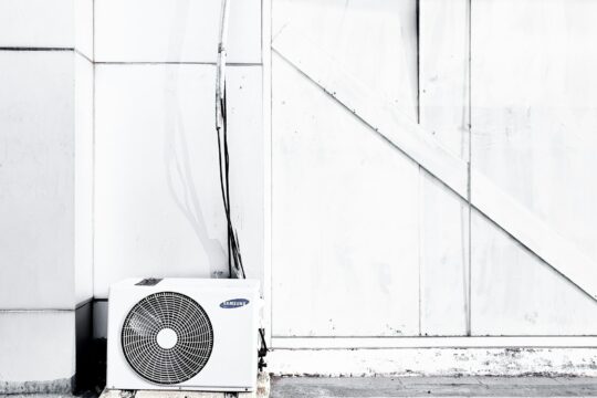 grayscale photography of outdoor AC unit